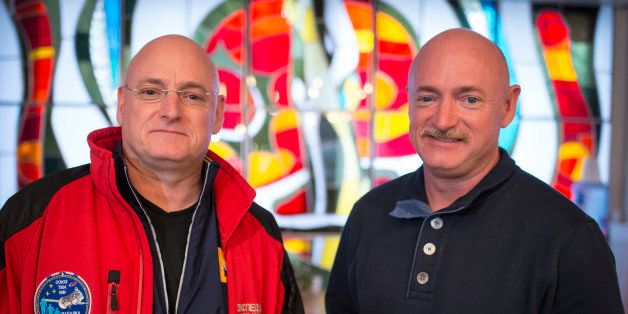 BAIKONUR, KAZAKHSTAN - MARCH 26: Expedition 43 NASA Astronaut Scott Kelly, left, and his identical twin brother Mark Kelly, pose for a photograph Thursday, March 26, 2015 at the Cosmonaut Hotel in Baikonur, Kazakhstan. Scott Kelly, and Russian Cosmonauts Mikhail Kornienko, and Gennady Padalka of the Russian Federal Space Agency (Roscosmos) are scheduled to launch to the International Space Station in the Soyuz TMA-16M spacecraft from the Baikonur Cosmodrome in Kazakhstan March 28, Kazakh time (March 27 Eastern time.) As the one-year crew, Kelly and Kornienko will return to Earth on Soyuz TMA-18M in March 2016. (Photo by Bill Ingalls/NASA via Getty Images)