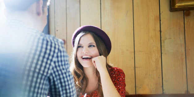 young woman and man chatting in cafe