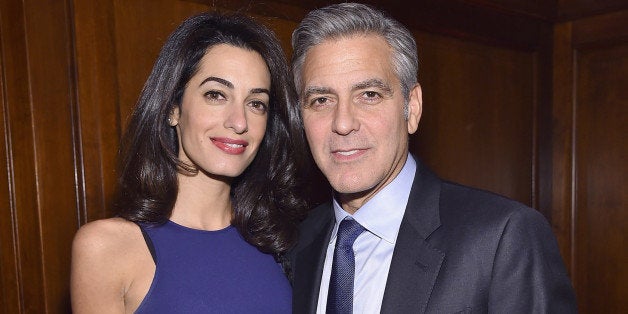 NEW YORK, NY - MARCH 10: Barrister Amal Clooney and actor George Clooney attend The 100 LIVES initiative, to express gratitude to the individuals and institutions whose heroic actions saved Armenian lives during the Genocide 100 years ago, on March 10, 2015 in New York City. The program, led by Ruben Vardanyan, Vartan Gregorian and Noubar Afeyan, establishes the Aurora Prize for Awakening Humanity as a means to empower modern-day saviors. During the event, the group reiterated the need to combat genocide and advance human rights efforts. (Photo by Mike Coppola/Getty Images for 100 LIVES)