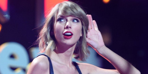 NEW YORK, NY - DECEMBER 12: Taylor Swift performs onstage during iHeartRadio Jingle Ball 2014, hosted by Z100 New York and presented by Goldfish Puffs at Madison Square Garden on December 12, 2014 in New York City. (Photo by Jamie McCarthy/Getty Images for iHeartMedia)