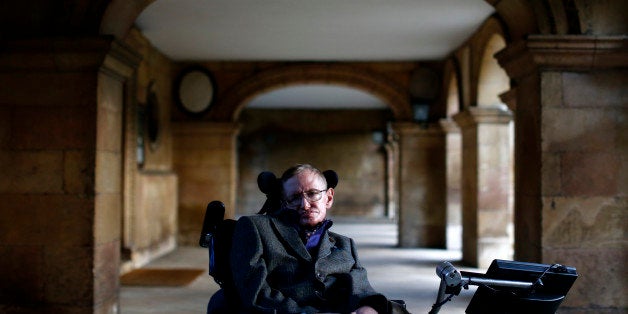 Theoretical physicist Stephen Hawking poses for a picture ahead of a gala screening of the documentary film 'Hawking', a film about his life, at the opening night of the Cambridge Film Festival in Cambridge, eastern England on September 19, 2013. Hawking tells the extraordinary tale of how he overcame severe disability to become the most famous living scientist in a new documentary film premiered in Britain. AFP PHOTO / ANDREW COWIE (Photo credit should read ANDREW COWIE/AFP/Getty Images)