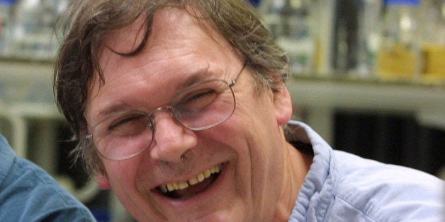 FILE - A Monday Oct. 8, 2001 photo from files of Dr. Tim Hunt, winner of the Nobel Prize for Medicine, in a laboratory in London. The Nobel Prize-winning British scientist has apologized Wednesday, June 10, 2015, for saying the "trouble with girls" working in science labs is that it leads to romantic entanglements and harms science. Tim Hunt made the comments at the World Conference of Science Journalists in South Korea, according to audience members. (AP Photo/Alastair Grant, File)