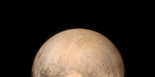 IN SPACE - JULY 14: In this handout provided by the National Aeronautics and Space Administration (NASA), Pluto nearly fills the frame in this image from the Long Range Reconnaissance Imager (LORRI) aboard NASA's New Horizons spacecraft, taken on July 13, 2015, when the spacecraft was 476,000 miles (768,000 kilometers) from the surface. This is the last and most detailed image sent to Earth before the spacecraft's closest approach to Pluto. New Horizons spacecraft is nearing its July 14 fly-by when it will close to a distance of about 7,800 miles (12,500 kilometers). The 1,050-pound piano sized probe, which was launched January 19, 2006 aboard an Atlas V rocket from Cape Canaveral, Florida, is traveling 30,800 mph as it approaches. (Photo by NASA/APL/SwRI via Getty Images)