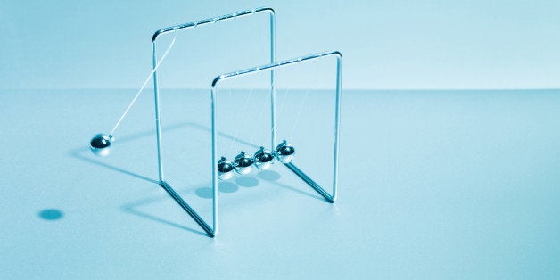 NewtonÂs cradle swinging