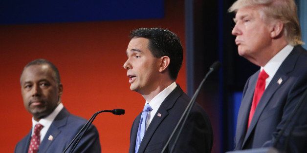 CLEVELAND, OH - AUGUST 06: Republican presidential candidates (L-R) Ben Carson, Wisconsin Gov. Scott Walker and Donald Trump participate in the first prime-time presidential debate hosted by FOX News and Facebook at the Quicken Loans Arena August 6, 2015 in Cleveland, Ohio. The top-ten GOP candidates were selected to participate in the debate based on their rank in an average of the five most recent national political polls. (Photo by Chip Somodevilla/Getty Images)