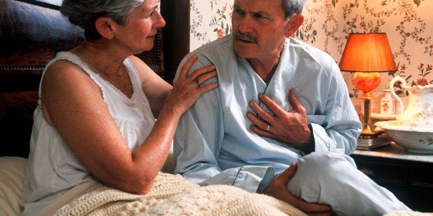 UNITED STATES - 2009/05/18: Senior man with chest pain is comforted by his concerned wife. (Photo by John Greim/LightRocket via Getty Images)