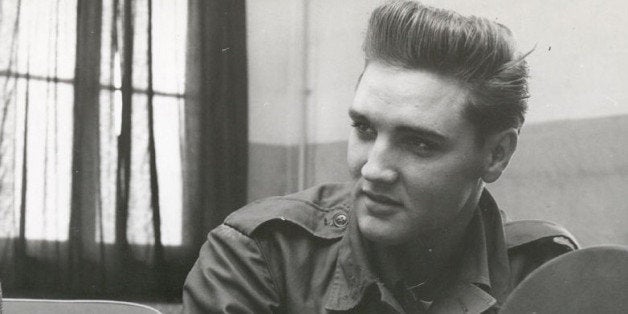 FILE - This is an Oct. 1958 file photo of Associated Press chief of bureau for Germany Richard O'Regan, as he interviews Elvis Presley. OâRegan, who covered some of the biggest stories of the Cold War in a 39-year career as reporter and executive for The Associated Press, has died in a Geneva, Switzerland, hospital, aged 95, it is announced by his son Kevin on Tuesday June 2, 2015. (AP Photo/FILE)