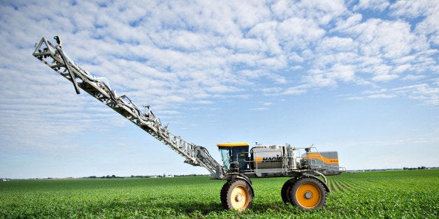 Farmer Matt Wiggeim sprays corn plants with a mist of weed killer, fungicide, and fertilizer using a Hagie Manufacturing Co. sprayer in Kasbeer, Illinois, U.S., on Monday, June 13, 2011. Corn fell to a one-month low and soybeans declined on speculation that favorable weather will boost yields in the U.S., the world's biggest grower and exporter. Photographer: Daniel Acker/Bloomberg via Getty Images