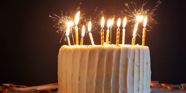 Birthday cake with candles and sparklers.