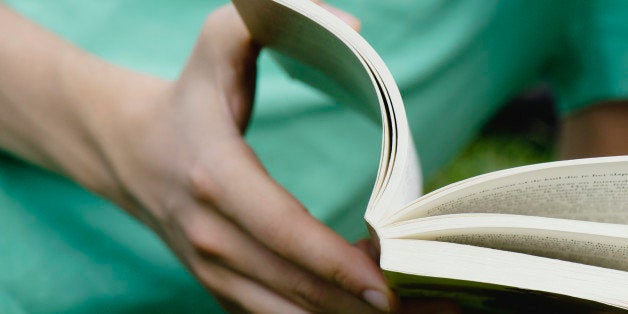 Man reading book, close-up