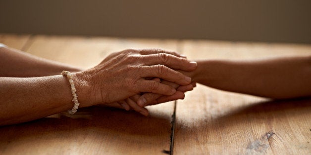 A cropped shot of a woman holding a loved one's hand in supporthttp://195.154.178.81/DATA/i_collage/pi/shoots/783366.jpg