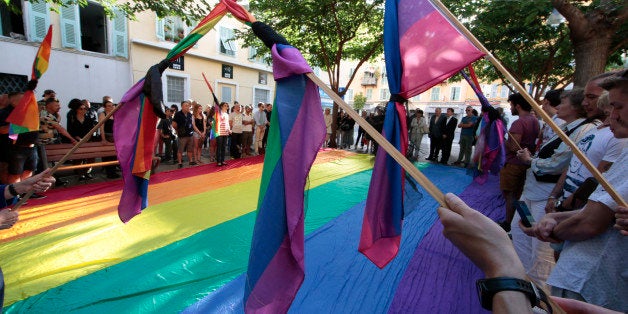 The Lesbian, gay, bisexual and transgender (LGBT) community observe a minute of silence in Nice, France, June 13, 2016 for victims of the shooting at a gay nightclub in Orlando, Florida. REUTERS/Eric Gaillard