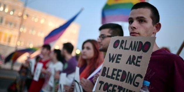 People march during a demonstration organised by the Greek LGBTQ community in support to the victims of June 12 Orlando shootings, on June 14, 2016 in Athens. On June 12, a man opened fire in Orlando gay club Pulse during a Latin themed night killing 49 people and injuring 53 others in Florida. The most deadly shooting in the history of the US shook up the LGBTQ community with many worldwide expressing their shock and sympathy. / AFP / LOUISA GOULIAMAKI (Photo credit should read LOUISA GOULIAMAKI/AFP/Getty Images)