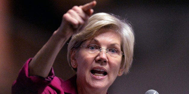 Massachusetts Senator Elizabeth Warren speaks to a rally of supporters of Kentucky senatorial candidate Alison Lundergan Grimes at the Copper & Kings Distillery in Louisville, Ky., Tuesday, Oct. 28, 2014. (AP Photo/Timothy D. Easley)