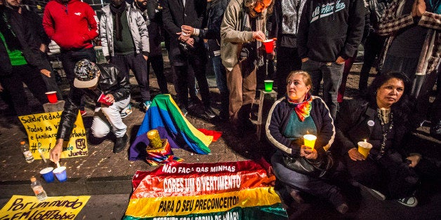 SAO PAULO, BRAZIL - JUNE 12: People and members of the gay community gather for a vigil near the Sao Paulo Museum of Art to