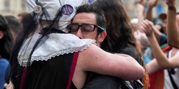 People gather on Terreaux square in Lyon, central-eastern France, on June 15, 2016, to pay tribute for the victims of the Orl