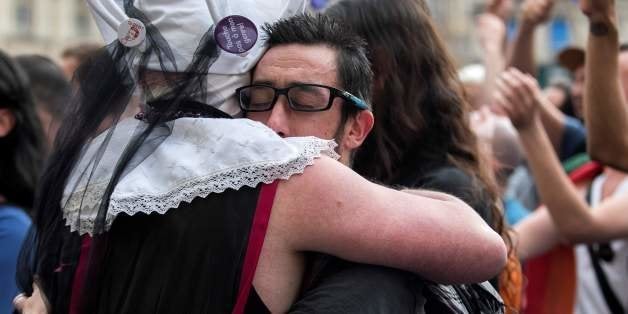 People gather on Terreaux square in Lyon, central-eastern France, on June 15, 2016, to pay tribute for the victims of the Orlando shooting in Florida. Forty-nine people were killed and 53 others wounded when a heavily armed gunman opened fire and seized hostages at a popular gay nightclub in Orlando, Florida -- the worst terror attack on US soil since September 11, 2001. / AFP / ROMAIN LAFABREGUE (Photo credit should read ROMAIN LAFABREGUE/AFP/Getty Images)