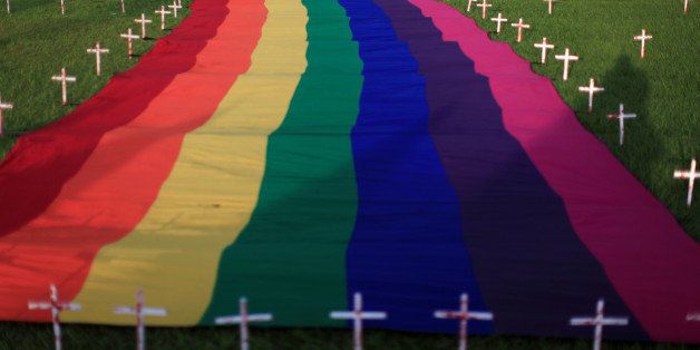 Members of the LGBT community participate in a vigil in memory of the victims of the Orlando Pulse gay nightclub shooting and hate crimes in San Salvador, El Salvador June 18, 2016. REUTERS/Jose Cabezas