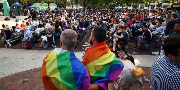ORLANDO, FL - JUNE 19: People wait for the start of a memorial service on June 19, 2016 in Orlando, Florida. Thousands of peo
