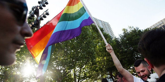 ORLANDO, FL - JUNE 19: People wait for the start of a memorial service for the victims of the Pulse nightclub massacre on June 19, 2016 in Orlando, Florida. Thousands of people are expected at the evening event which will feature entertainers, speakers and a candle vigil at sunset. In what is being called the worst mass shooting in American history, Omar Mir Seddique Mateen killed 49 people at the popular gay nightclub early last Sunday. Fifty-three people were wounded in the attack which authorities and community leaders are still trying to come to terms with. (Photo by Spencer Platt/Getty Images)