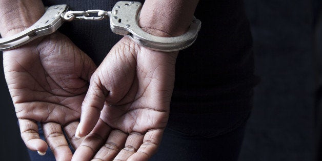 Black woman in handcuffs