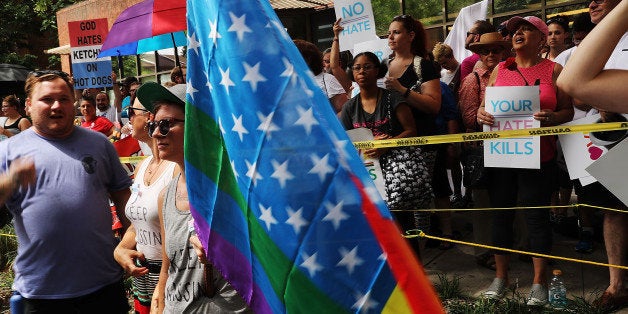 PHILADELPHIA, PA - JULY 26: Over 1,000 people gather outside of a LGBT center in downtown Philadelphia to protect it from Westboro Baptist Church members during the Democratic National Convention (DNC) on July 26, 2016 in Philadelphia, Pennsylvania. The church members, known for their hatred of the gay community and others, abandoned their plan to demonstrate.The convention officially began on Monday and is expected to attract thousands of protesters, members of the media and Democratic delegates to the City of Brotherly Love. (Photo by Spencer Platt/Getty Images)