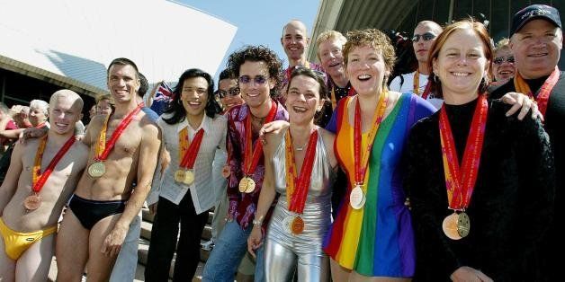 SYDNEY, AUSTRALIA: Medal winners from the 2002 Gay Games, gather on the steps of the Sydney Opera House 08 November 2002, for a group photo session. The games have seen 12,000 athletes from around the world compete in over 31 different sports and will conclude on 09 November. AFP PHOTO/Greg WOOD (Photo credit should read GREG WOOD/AFP/Getty Images)