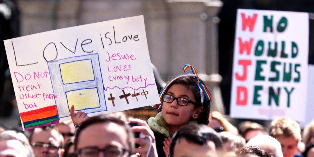 Demonstrators gather at Monument Circle to protest a controversial religious freedom bill recently signed by Governor Mike Pence during a rally in Indianapolis March 28, 2015. More than 2,000 people gathered at the Indiana State Capital Saturday to protest Indiana?s newly signed Religious Freedom Restoration Act saying it would promote discrimination against individuals based on sexual orientation. REUTERS/Nate Chute