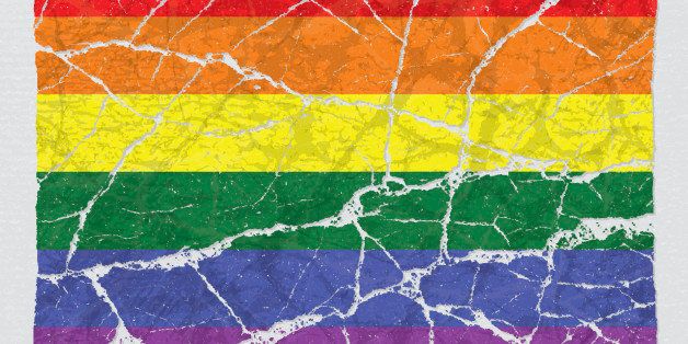 Cracked broken grunge textured lgbt rainbow gay pride flag.