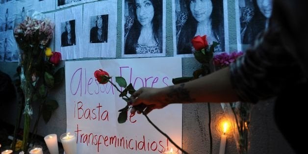 People light candles during a protest for the murdering of transsexual Alessa Flores, in Mexico City on October 14, 2016. / AFP / PEDRO PARDO (Photo credit should read PEDRO PARDO/AFP/Getty Images)