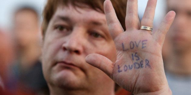 Anthony Starcher sends a message during a vigil in Biloxi, Miss., on Monday June 13, 2016, to honor the victims of the mass shooting in Orlando, Fla. (John Fitzhugh/Biloxi Sun Herald/TNS via Getty Images)