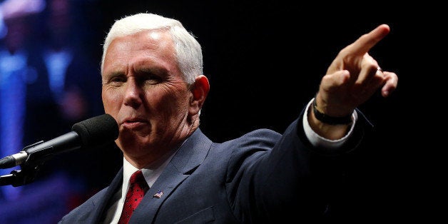 Republican vice presidential nominee Mike Pence attends a campaign rally in Manchester, New Hampshire, U.S. November 7, 2016. REUTERS/Carlo Allegri