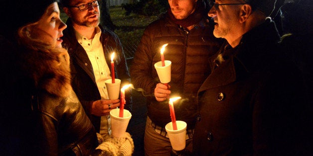 Demonstrators hold a candlelight vigil against President-elect Donald Trump's election, in Lafayette Park, near the White House, in Washington, U.S., November 12, 2016. REUTERS/Mike Theiler