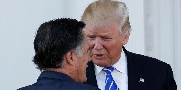 U.S. President-elect Donald Trump greets former Massachusetts Governor Mitt Romney (L) as he arrives for their meeting at the main clubhouse at Trump National Golf Club in Bedminster, New Jersey, U.S., November 19, 2016. REUTERS/Mike Segar