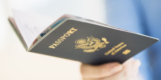 USA, New Jersey, Jersey City, Close up of woman's hand holding open passport