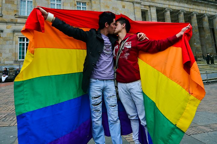 A gay couple kisses during a protest by the lesbian, gay, transgender and bisexual (LGTB) community demanding for their rigths --including gay marriage-- at the Bolivar Square in Bogota on November 27, 2012. AFP PHOTO/Luis Acosta (Photo credit should read LUIS ACOSTA/AFP/Getty Images)