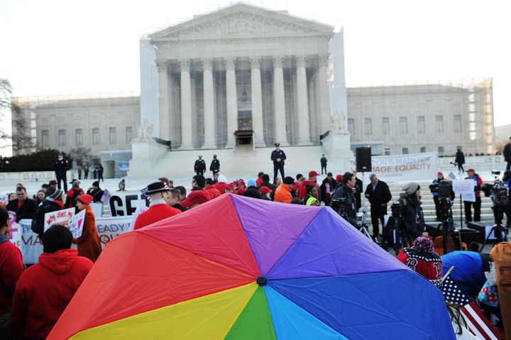 Supporters of same-sex marriage gather in front of the US Supreme Court on March 26, 2013 in Washington, DC. Same-sex marriage takes center stage at the US Supreme Court on Tuesday as the justices begin hearing oral arguments on the emotionally-charged issue that has split the nation. AFP PHOTO/Jewel Samad (Photo credit should read JEWEL SAMAD/AFP/Getty Images)
