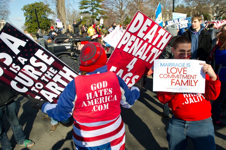 Pro-gay marriage activists shout slogans against anti-gay activists(R) they march on the US Supreme Court March 26, 2013 in Washington, DC. Same-sex marriage takes center stage at the US Supreme Court on Tuesday as the justices begin hearing oral arguments on the emotionally-charged issue that has split the nation. AFP PHOTO / Karen BLEIER (Photo credit should read KAREN BLEIER/AFP/Getty Images)