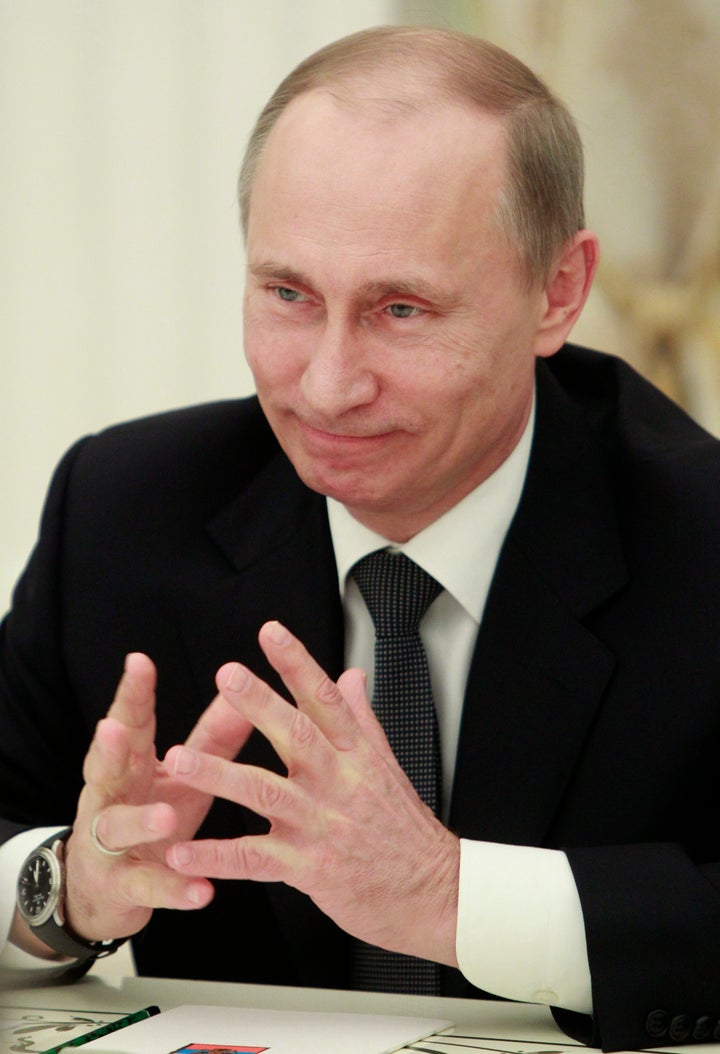 Russia's President Vladimir Putin smiles during a meetsing with Organisation for Economic Co-operation and Development (OECD) chief Angel Gurria at the Kremlin in Moscow, February 14, 2013. AFP PHOTO / POOL/ MAXIM SHEMETOV (Photo credit should read MAXIM SHEMETOV/AFP/Getty Images)