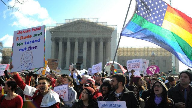 Same-sex marriage supporters shout slogans in front of the US Supreme Court on March 26, 2013 in Washington, DC. The US Supreme Court on Tuesday takes up the emotionally charged issue of gay marriage as it considers arguments that it should make history and extend equal rights to same-sex couples. Waving US and rainbow flags, hundreds of gay marriage supporters braved the cold to rally outside the court along with a smaller group of opponents, some pushing strollers. Some slept outside in hopes of witnessing the historic hearing. AFP PHOTO/Jewel Samad (Photo credit should read JEWEL SAMAD/AFP/Getty Images)