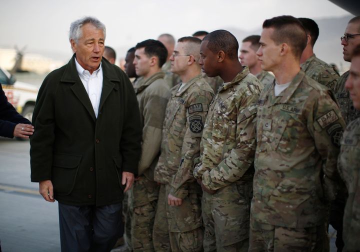 KABUL, AFGHANISTAN - MARCH 11: U.S. Secretary of Defense Chuck Hagel greets U.S. Army troops on the tarmac of Kabul airport before boarding a flight to Washington on March 11, 2013 in Kabul, Afghanistan. Hagel ended his three day visit to Afghanistan on Monday, his first as Secretary of Defense. (Photo by Jason Reed-Pool/Getty Images)