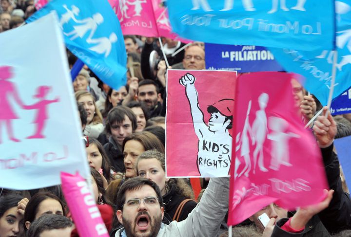 People take part in a protest against gay marriage on April 4, 2013 in front of the French Senate in Paris, on the first day of the debate at France's upper house on the controversial bill to legalise same-sex marriage and adoption. While the upper house is unlikely to reject the groundbreaking reform, it is still expected to be a tight vote as the ruling Socialists enjoy a smaller majority in the Senate than in the National Assembly. AFP PHOTO / PIERRE ANDRIEU (Photo credit should read PIERRE ANDRIEU/AFP/Getty Images)