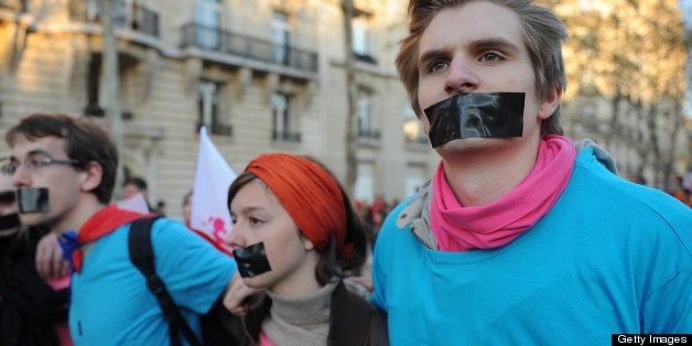 PARIS, FRANCE - APRIL 23: Anti-same sex marriage activists of the anti-gay marriage movement 'la Manif pour Tous' protest during a demonstration, a few hours after the French Parliament adopted gay marriage law at the Assemblee Nationale on April 23, 2013 in Paris, France. The bill was approved by a vote in Parliament of 331 to 225. (Photo by Antoine Antoniol/Getty Images)