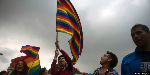 LGTB activists demonstrate outside the Colombian Congress in Bogota on April 23, 2013, at the time the Colombian Senate is to discuss the same-sex marriage bill. AFP PHOTO/Eitan Abramovich (Photo credit should read EITAN ABRAMOVICH/AFP/Getty Images)