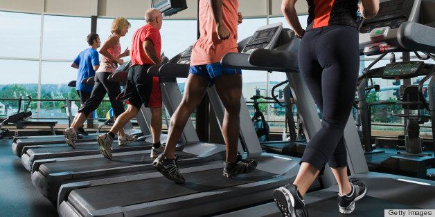 Men and women running on treadmills