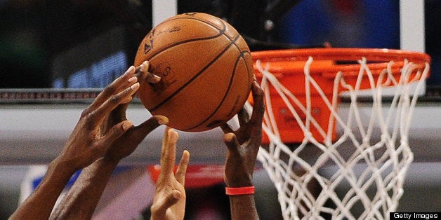 Lamar Odom of the Los Angeles Clippers gains the advantage beside the basket against the Milwaukee Bucks during their NBA gam