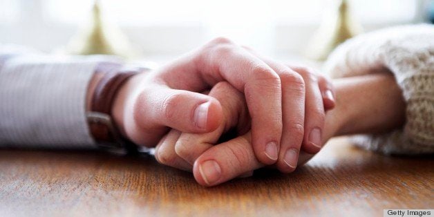 Man and woman holding each other's hands