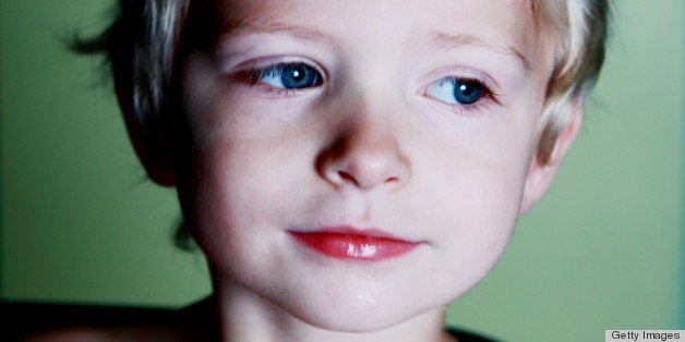 Close-up of boy wearing diamond tiara.