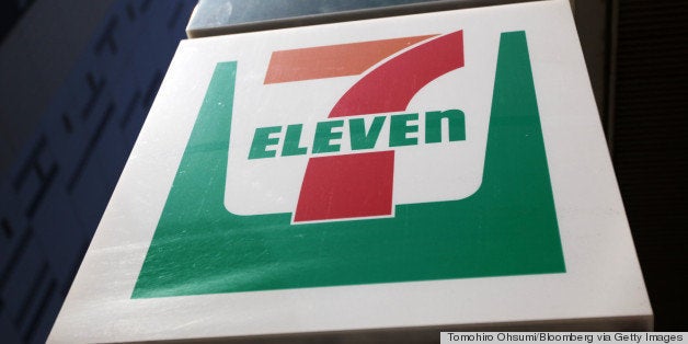 Signage for the 7-Eleven convenience-store is displayed in Tokyo, Japan, on Thursday, April 5, 2012. Seven & I Holdings Co.,