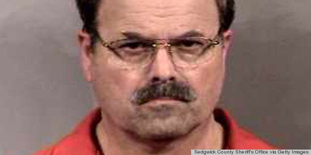 SEDGWICK COUNTY, KS - FEBRUARY 27: In this handout image provided by the Sedgwick County Sheriff's office, BTK murder suspect Dennis Rader stands for a mug shot released February 27, 2005 in Sedgwick County, Kansas. Rader is the suspect whom police have arrested on suspicion of first-degree murder in connection with the 10 deaths now tied to the serial killer known as BTK. (Photo by Sedgwick County Sheriff's Office via Getty Images)